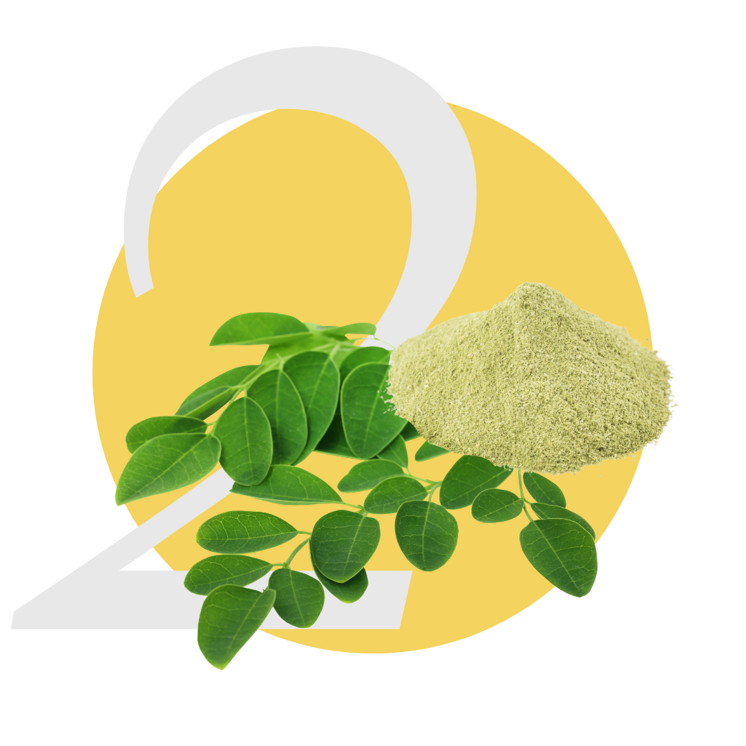 Leaves and a pile of green powder against a yellow and white number 2 background.