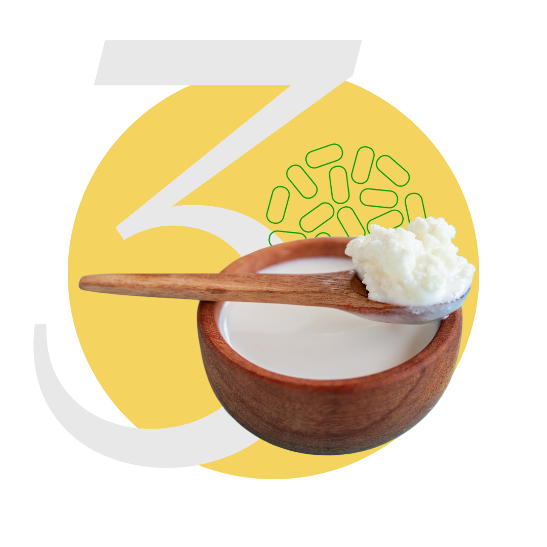 Wooden bowl and spoon with kefir grains, yellow background with white number 3 and green shapes.